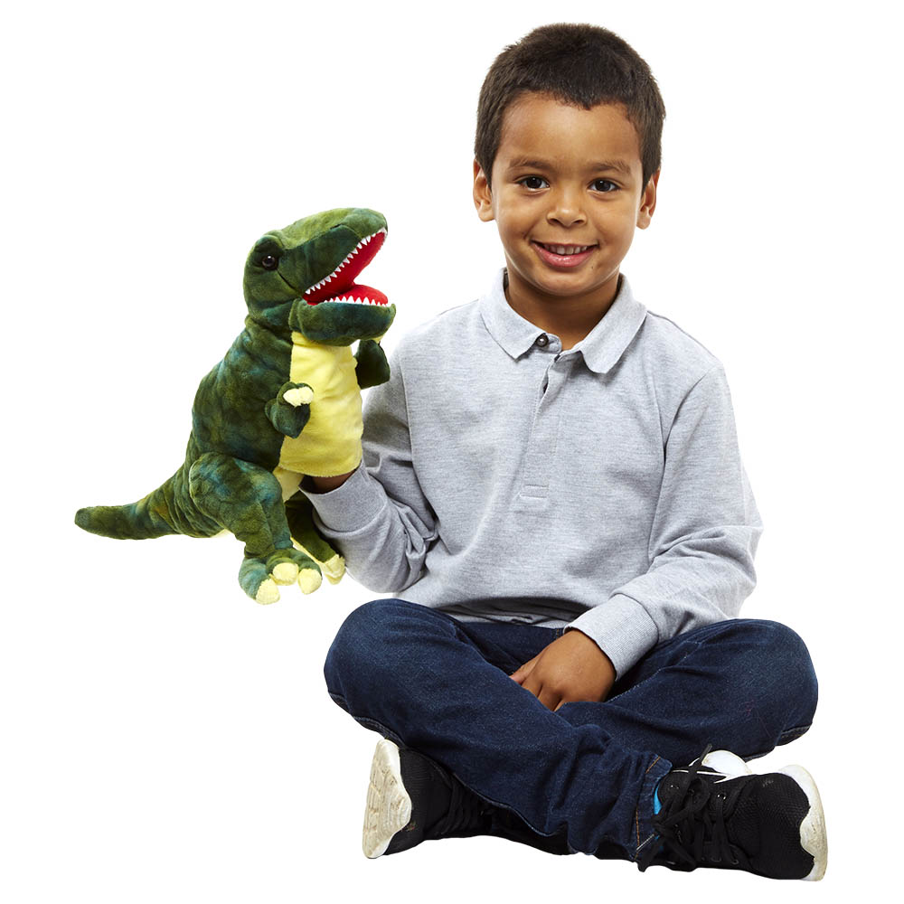 Boy holding the The Puppet Company Baby Tyrannosaurus Rex dinosaur hand puppet on his hand, usage example