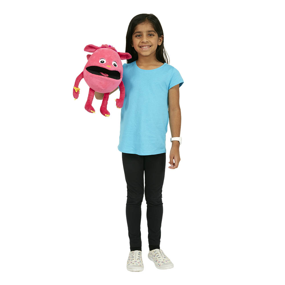 Girl holding the The Puppet Company pink baby monster hand puppet on her arm, usage example