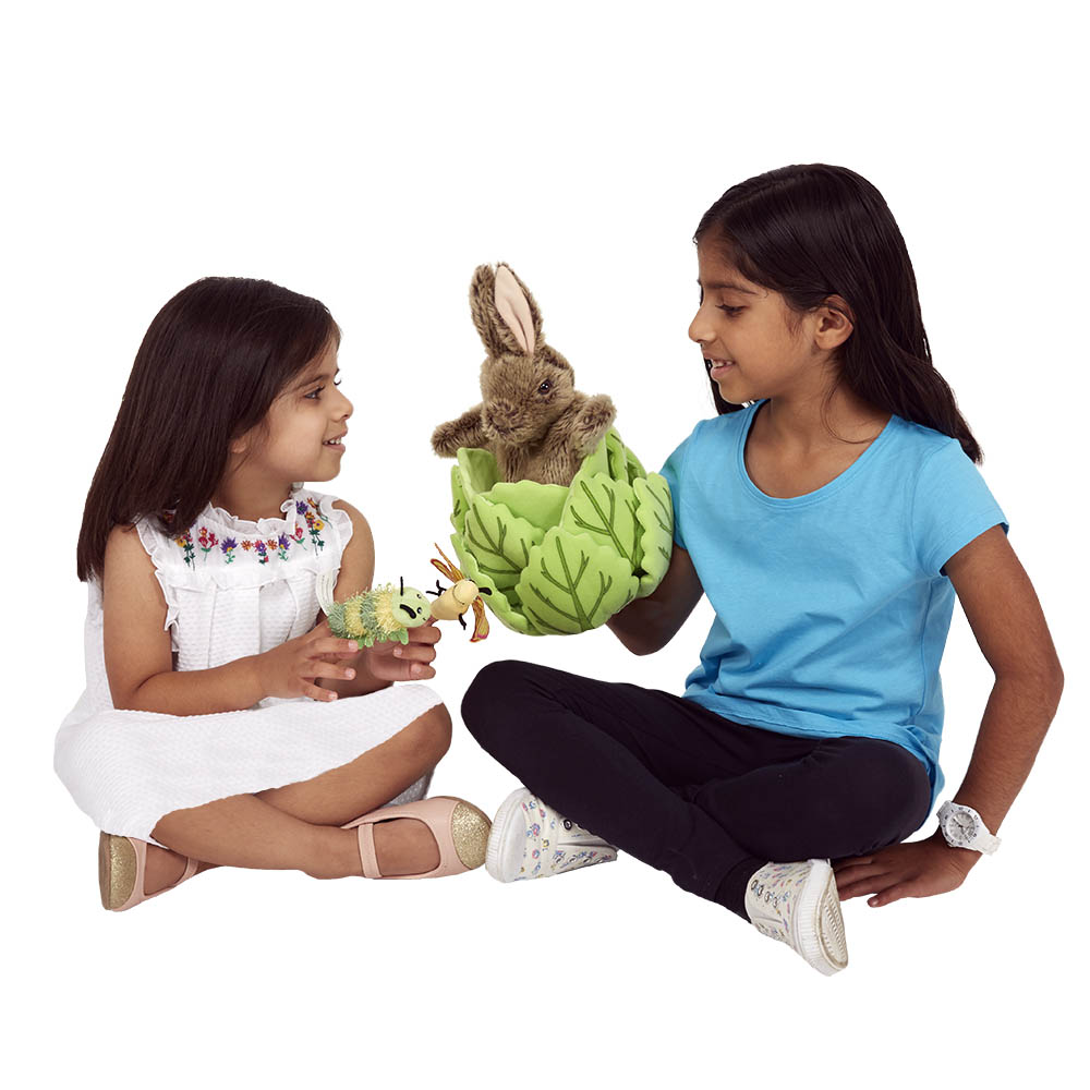 Two girls playing together with the The Puppet Company rabbit in lettuce hand puppet