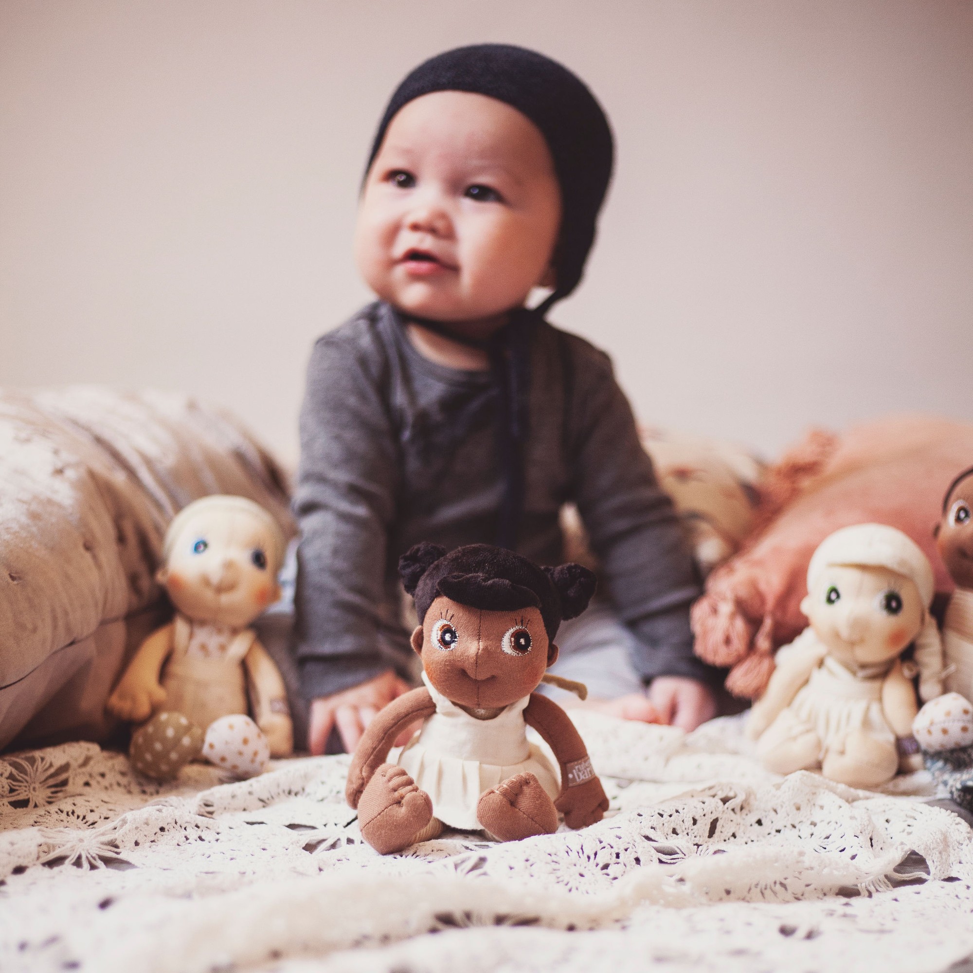 Baby with the Rubens EcoBuds mini dolls, Flora in the foreground