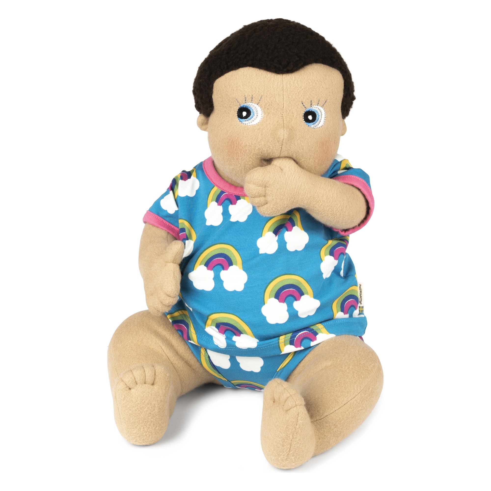 Rubens Barn baby doll Morra in the rainbow outfit, thumb at its mouth