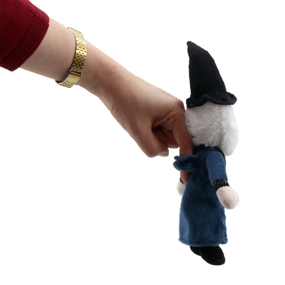 Hand holding the The Puppet Company finger puppet wizard on a finger, usage example with a wristwatch
