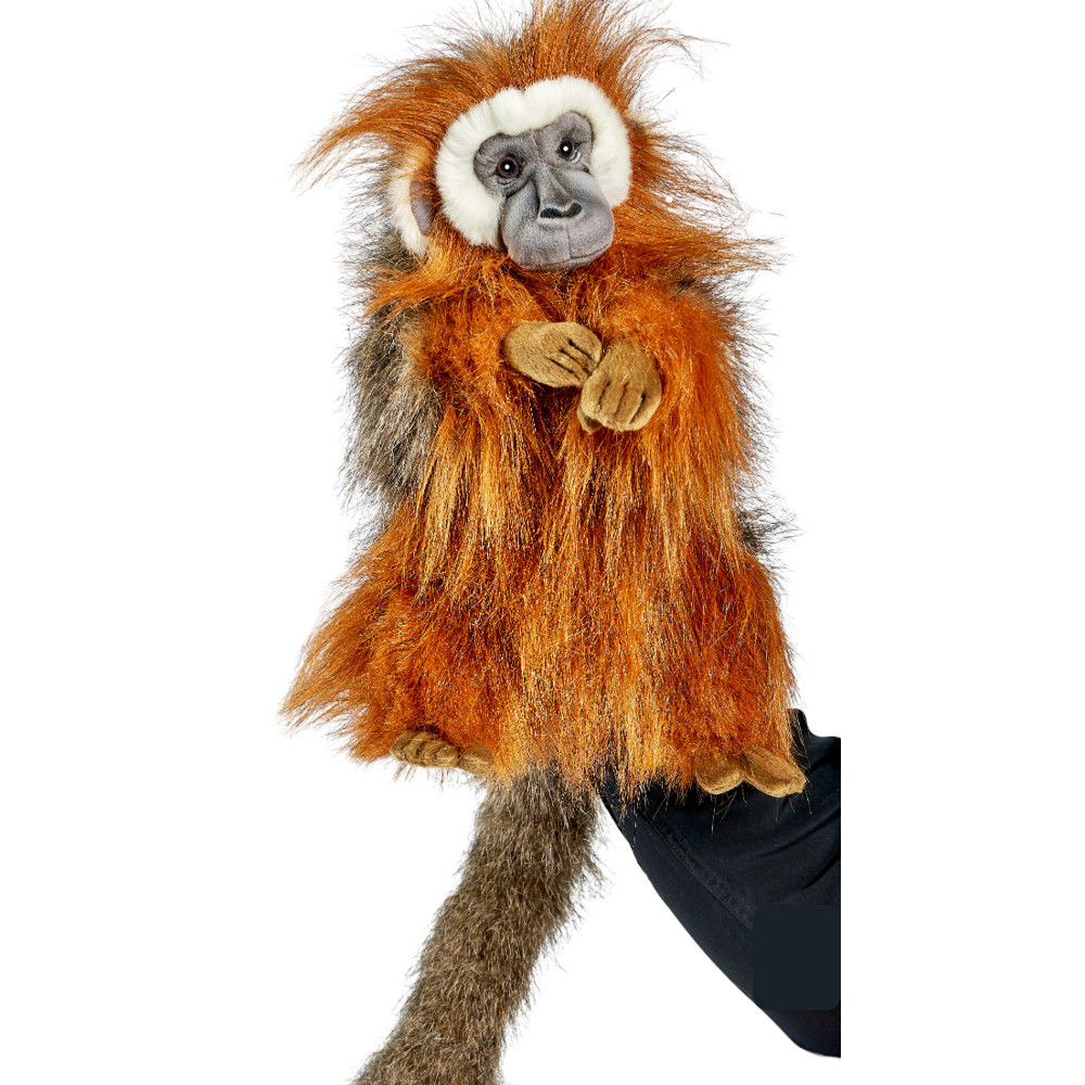 Titi-Affe Handpuppe von Hansa Creation mit zotteligem rotbraunem Fell, grauem Gesicht und langem Schwanz