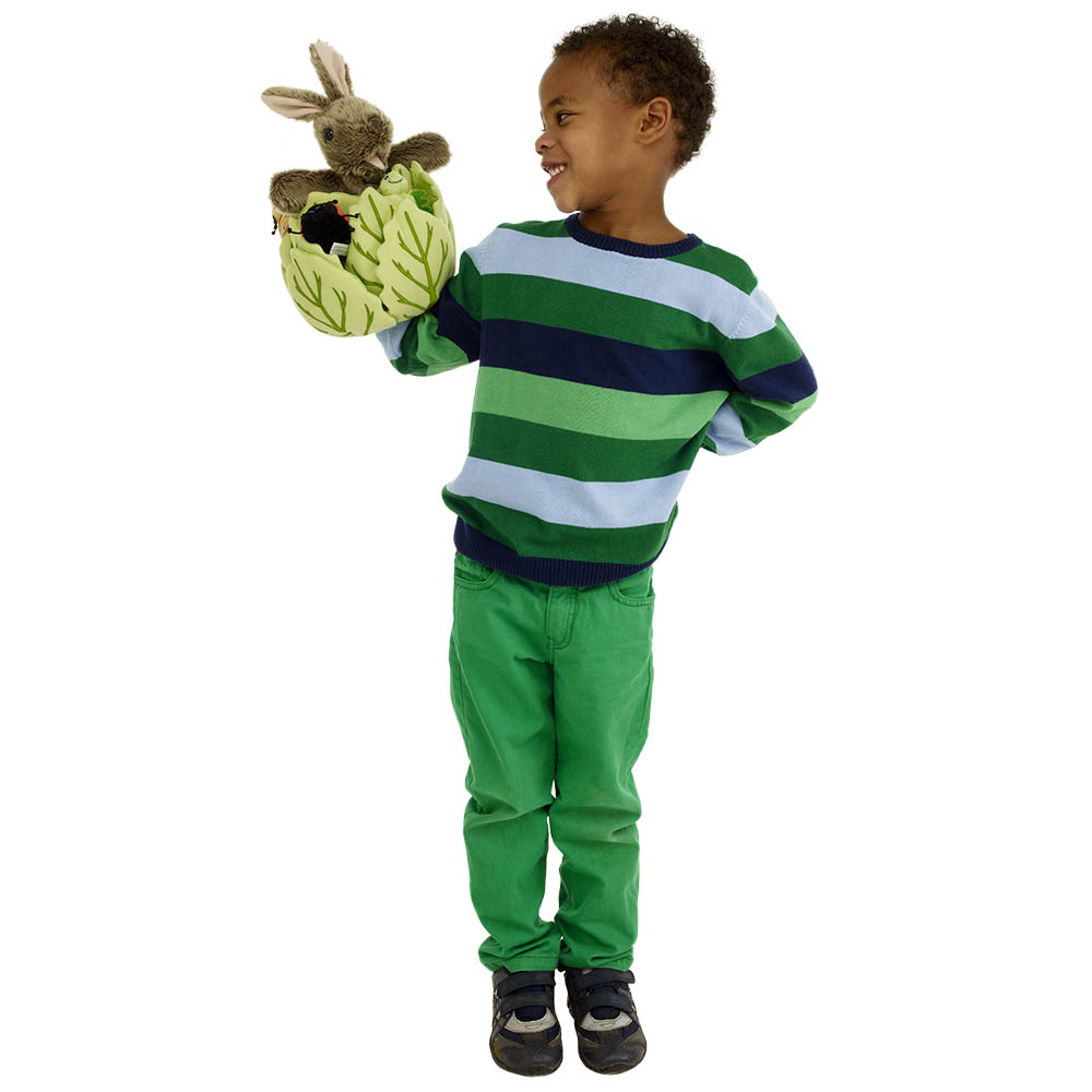 Boy wearing glasses holding the The Puppet Company rabbit in lettuce hand puppet, usage example