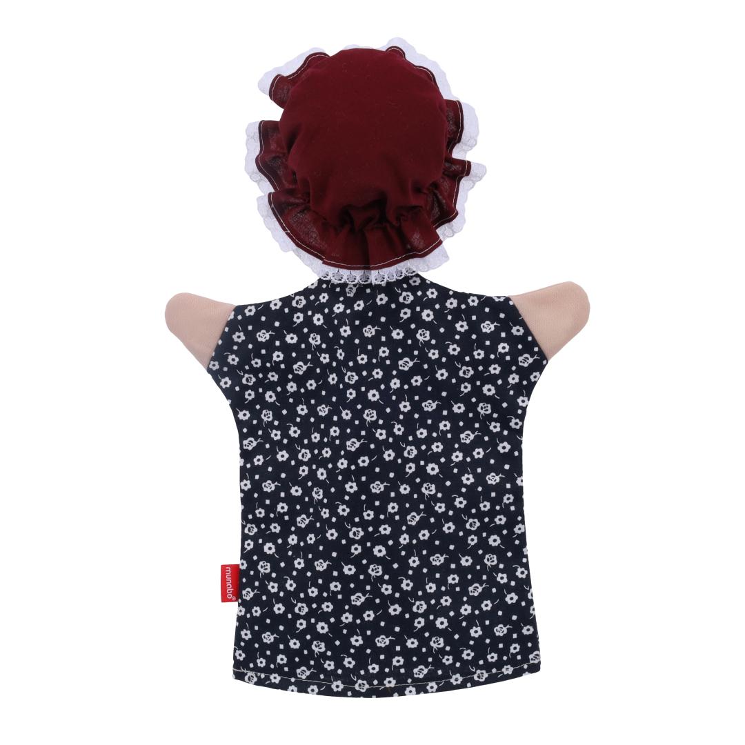 Grandmother hand puppet by munabo, rear view of the frilled bonnet over the floral dress.