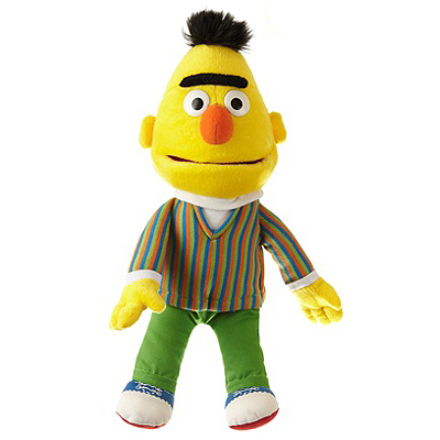 Living Puppets hand puppet Mini Bert from Sesame Street with a yellow head, black eyebrow, striped jacket and green trousers