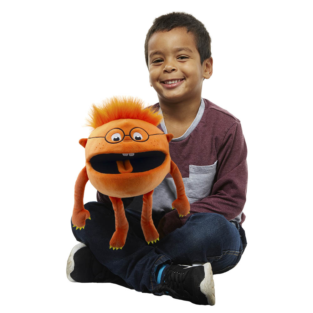Boy holding the The Puppet Company orange baby monster hand puppet on his lap, usage example