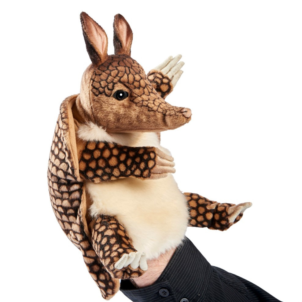 Armadillo hand puppet by Hansa Creation with a brown patterned scaly shell, light chest and long snout