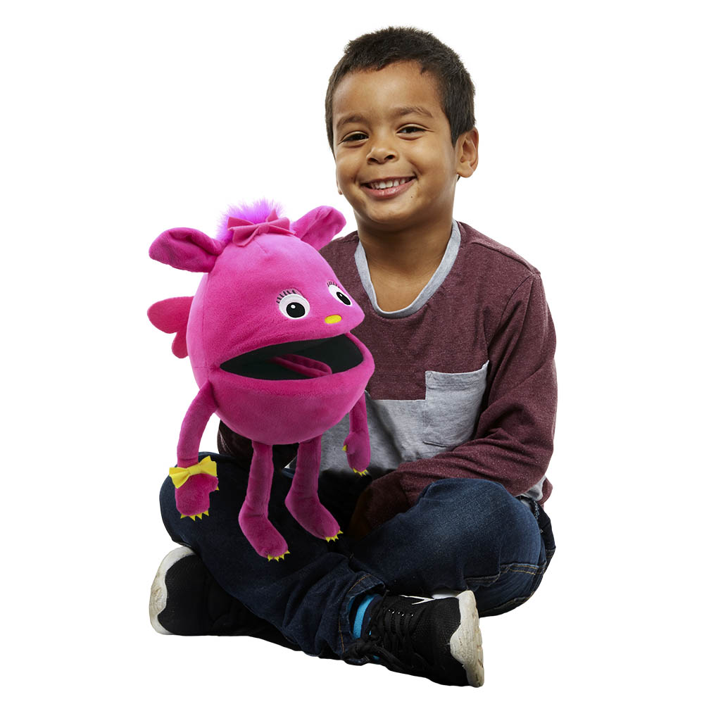Boy holding the The Puppet Company pink baby monster hand puppet on his arm, usage example